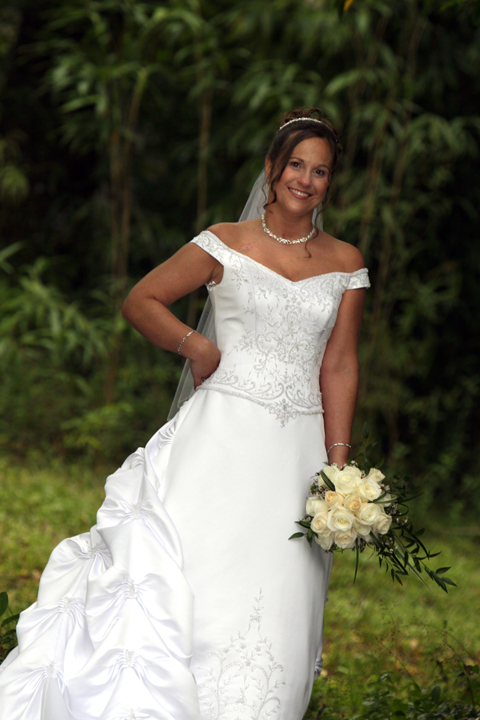 Stacey looking beautiful in her wedding dress on the grounds of the Summer House.